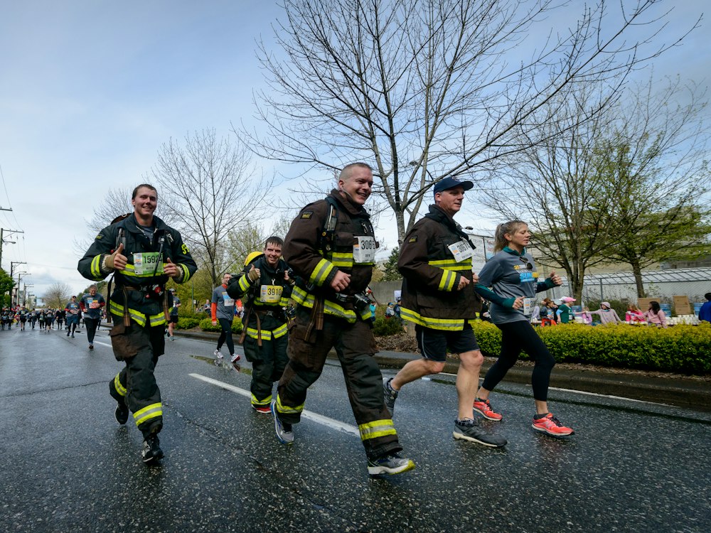 Firefighters running together on a Vancouver street